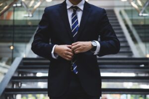 Executive in business attire outside a modern office