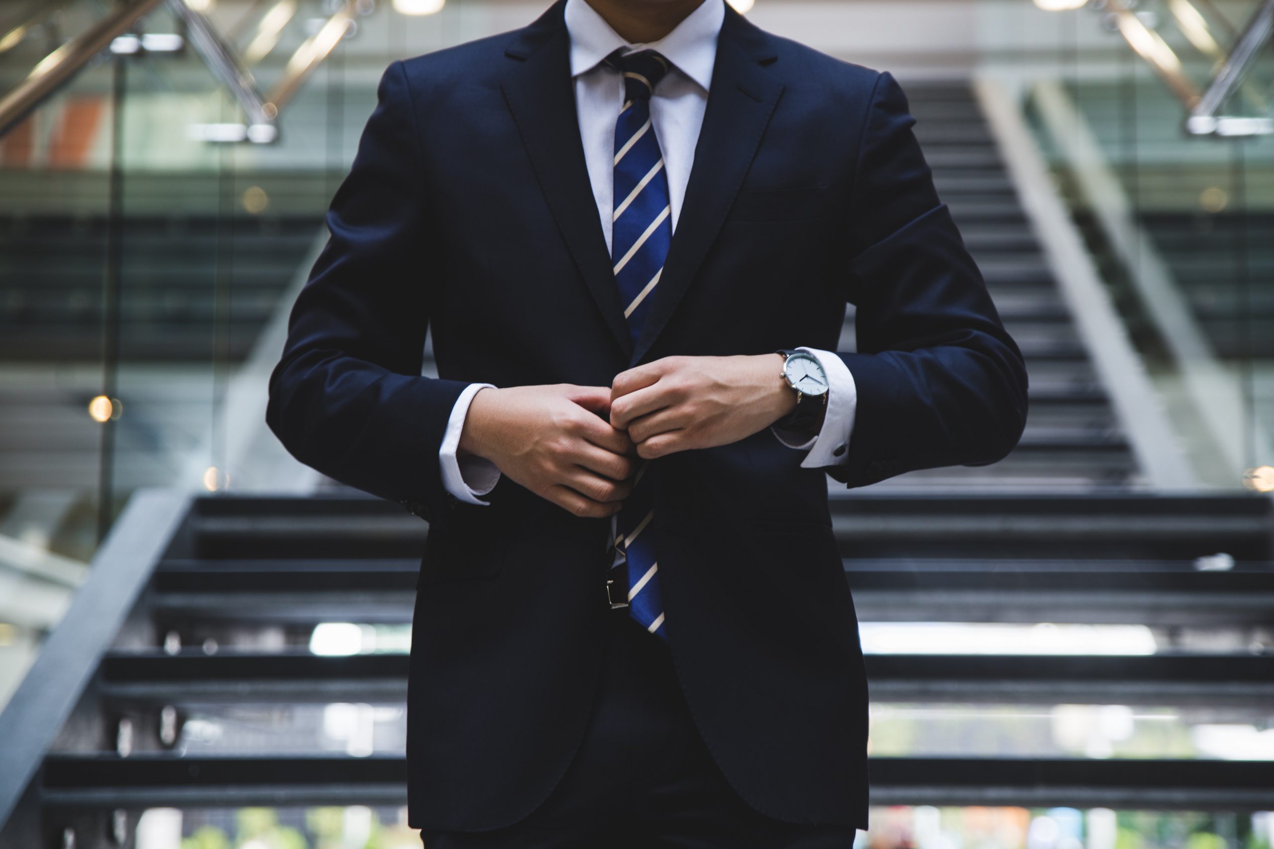 Executive in business attire outside a modern office